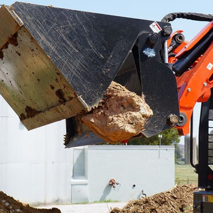 4 in 1 skid steer bucket side view and in use