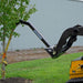 blue diamond tree boom for a skid steer side view