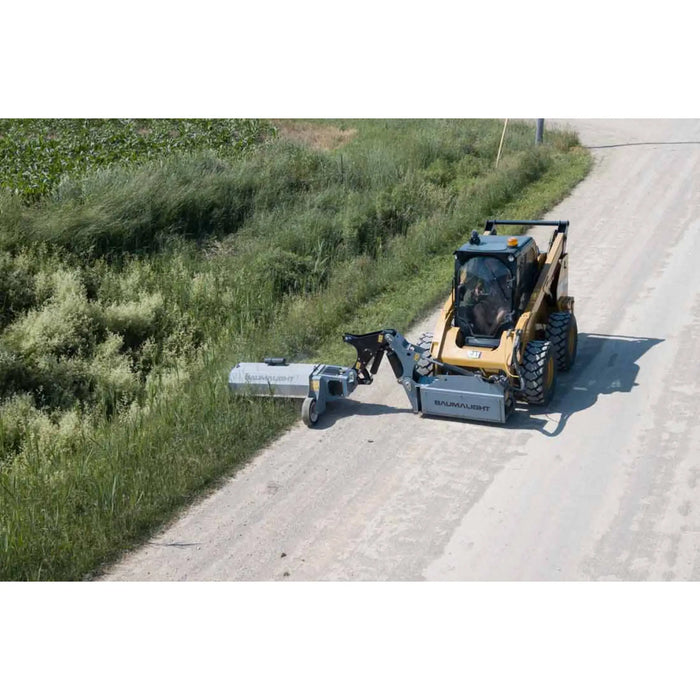 boom mower in field