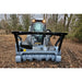 brush mulcher skid steer front in field