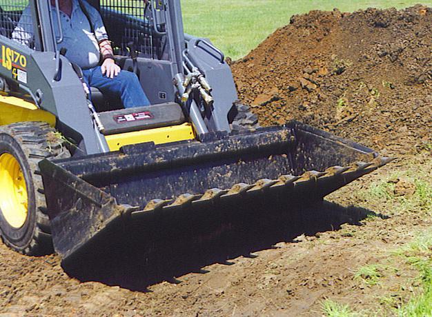 bucket attachment half view in action on dirt