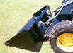 bucket for skid steer side view in action