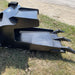 bucket for skid steer side view on ground