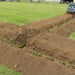 lowe skid steer trench in use and trench dug