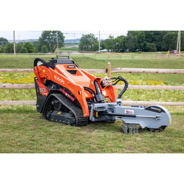 mini skid steer attachment on farm