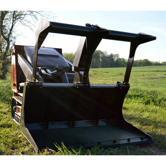 mini skid steer bucket on grass