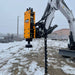 montana post driver on bobcat excavator front view in use