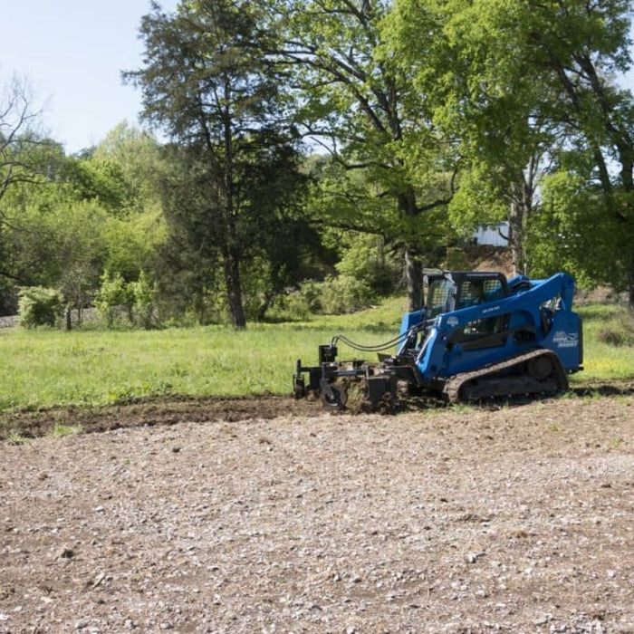 power rake skid steer in action