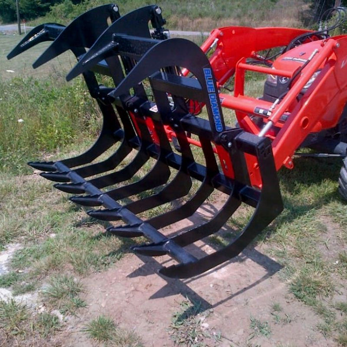 skid steer grapple attachment in action