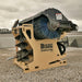 skid steer grapple bucket storage with broom attachment on unit