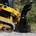 skid steer grapple rake left side view