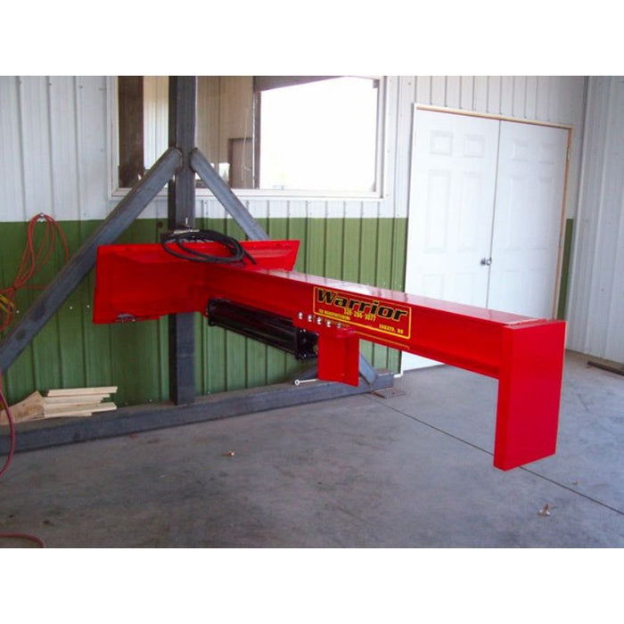 skid steer log splitter attachment hanging in warehouse front right view