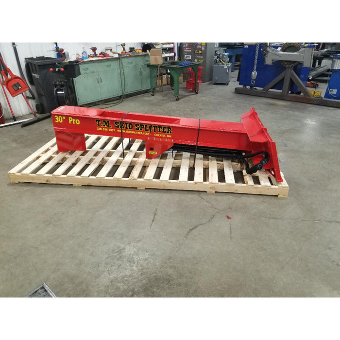 skid steer mounted log splitter on pallet right side view