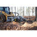 skid steer stump remover half view in action