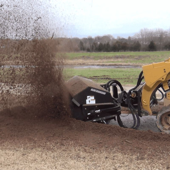 skid steer sweeper attachment in action