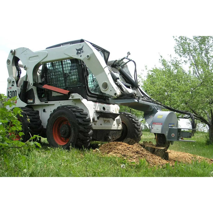 skid steer tree grinder in action