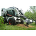 skid steer tree grinder in action