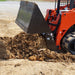 skid steer 4 in 1 bucket on skid steer dumping dirt