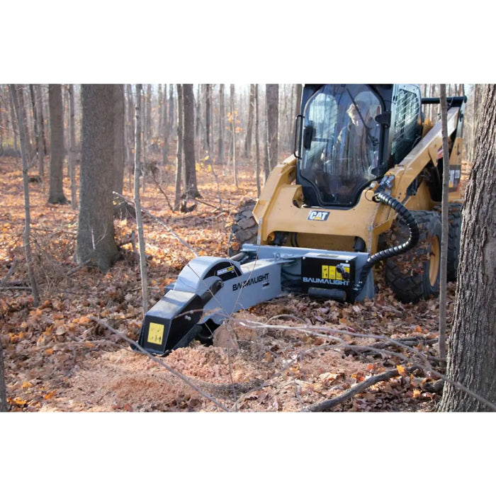 stump grinder on skid steer in action