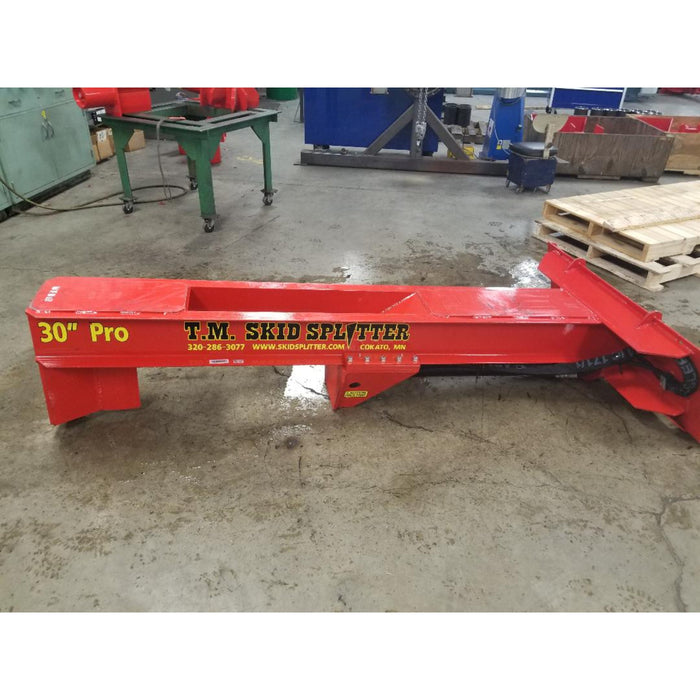 wood splitter attachment for skid steer right side view on ground